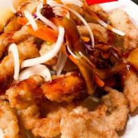 Tangsuyook · Pork, lightly battered, and deep-fried, drizzled with sweet and sour sauce.