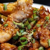 Gganpung Chicken · Boneless chicken, lightly battered, and deep-fried tossed in a spicy garlic sauce.