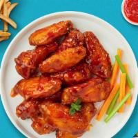 Buffalo Bluff Wings  · Fresh chicken wings breaded, fried until golden brown, and tossed in buffalo sauce. Served w...