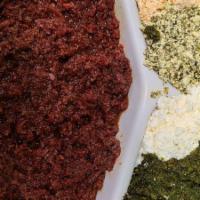 Regular Kitfo · Delicious Ethiopian steak tartare, tender chopped beef seasoned with spiced butter and mitmi...