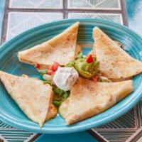 Hector'S Quesadilla · Grill a flour tortilla filled with cheese and mild red and green chiles, add a little sour c...
