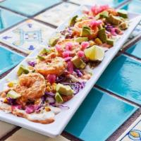 Mayan Shrimp · Lightly fried shrimp, tossed in chipotle aioli with fire roasted corn salsa, pickled onions,...