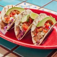 Original Fish Tacos · Tortilla-encrusted fish, roasted corn salsa, shredded red cabbage and chipotle aioli on soft...