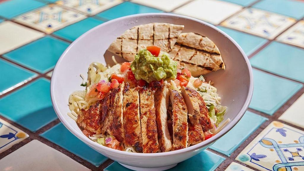 Chicken Fajita Salad · Half Fajita, half salad, 100% beautiful. Grilled chicken atop a bed of lettuce with beans, seared onions and peppers, salsa fresca, cheese and guacamole.