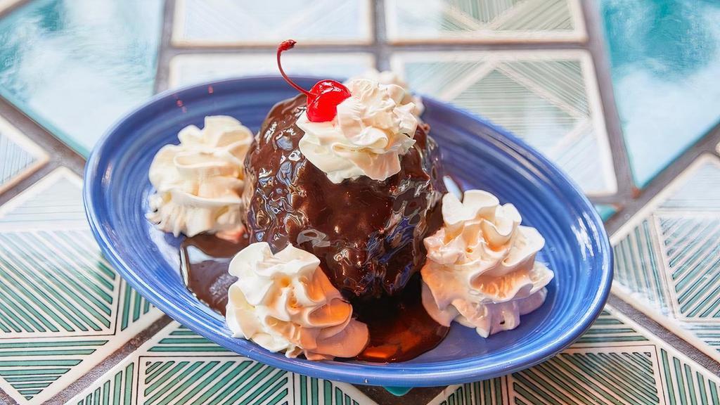Fried Ice Cream · Sweet vanilla ice cream with a salty crushed pretzel shell, covered in chocolate sauce or honey - both, if you’re feeling loco!