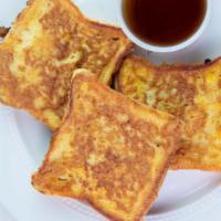 French Toast · 3 slices of Texas toast topped with cinnamon and powered sugar.