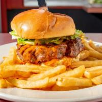 Michael'S Buffalo Burger · Topped with our homemade wing sauce and blue cheese
