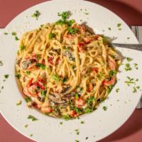 Pasta Special · Portabella mushrooms, roasted peppers, sun-dried tomatoes in roasted garlic cream sauce over...