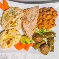 Sarah'S Vegetarian Combo Platter · Sampling of hummus, baba Ghannouj, foul dip, falafel and grape leaves.