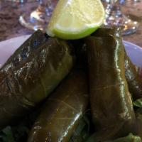 Grape Leaves · Homemade grape leaves stuffed with rice, herbs and spices.