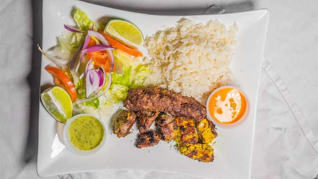 Mixed Grill · Kufta, lamb and chicken kabobs with rice and salad.