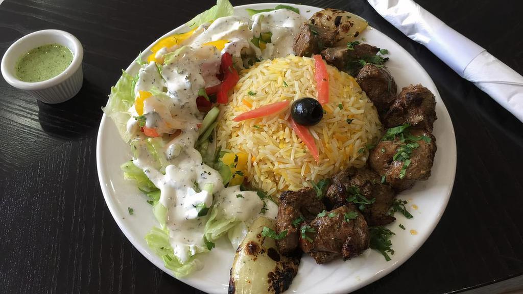 Lamb Kabob · Tender delicate chunks of lamb marinated in our special herbs and spices. Served with rice and salad.