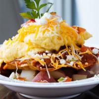 Ranchero Bowl · Ranchero sauce, scrambled eggs, and corn tortilla on potatoes with cheddar cheese.