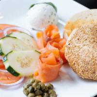 Deluxe Bagel · Smoked salmon, cucumber, tomato, red onion, capers, and cream cheese.