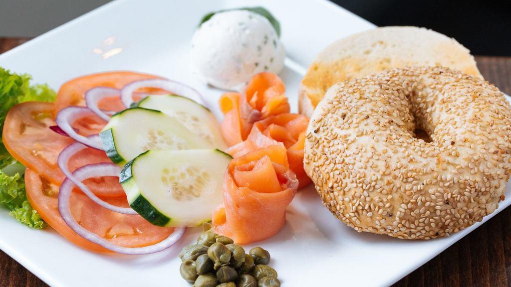 Deluxe Bagel · Smoked salmon, cucumber, tomato, red onion, capers, and cream cheese.