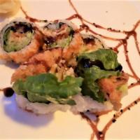 Spider Roll · Deep fried whole soft shell crab, cucumber, avocado, crab meat and tobiko outside.