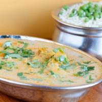 Chicken  Korma  (G) · Boneless chicken pieces cooked in a creamy onion sauce and nut