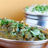 Palak Paneer  (G) · Homemade cheese cubes cooked with fresh chopped spinach and herbs