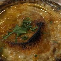 Soupe A L'Oignon Gratinée · Caramelized onions, croutons, cheese crust
