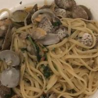 Linguini With Clams · Little neck clams sauteed in olive and garlic, over a bed of linguini, and finished in a red...