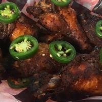 Smoked Wings · Six jumbo wings topped with jalapeño slices. Served with side of Mumbo sauce or Bama sauce (...