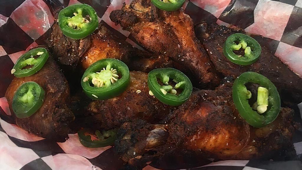 Smoked Wings · Six jumbo wings topped with jalapeño slices. Served with side of Mumbo sauce or Bama sauce (inspired by Alabama White BBQ sauce).