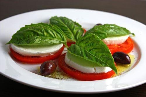 Caprese Salad · Fresh mozzarella, vine-ripened tomatoes, fresh basil, & salt drizzled with balsamic and extra virgin olive oil.
