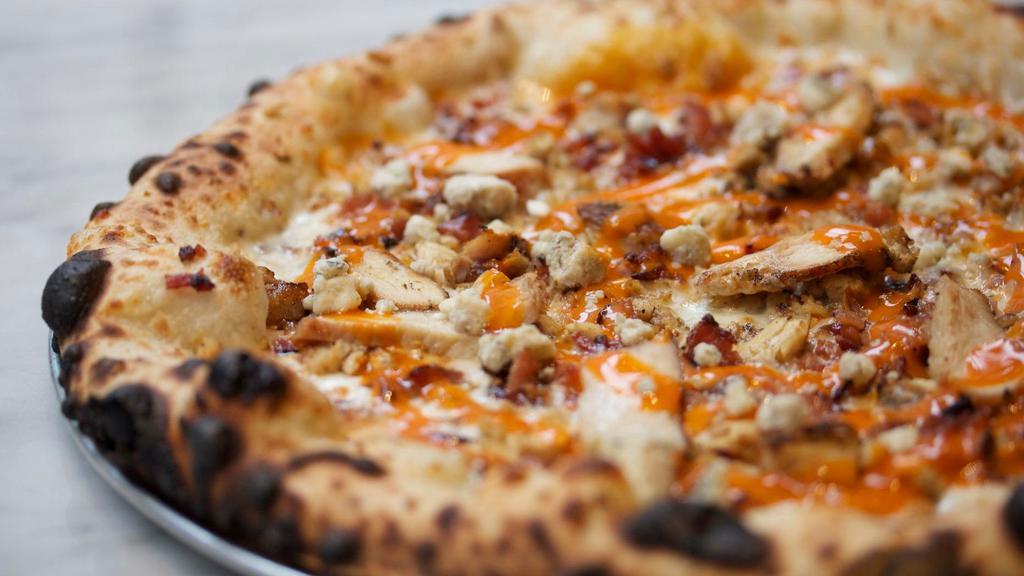 Crazy Buffalo Chicken Pizza · Grilled chicken, Spicy buffalo sauce, bacon & a drizzle of creamy blue cheese