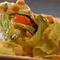 Italian Salad · Crisp romaine lettuce with tomato, cucumbers, chick peas, green peppers, and red onion tosse...