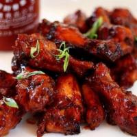 Small Wings · Braised marinated wings tossed in your choice of sauce and then fire roasted in our 1000 deg...