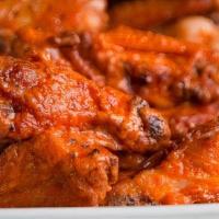 Large Wings · Braised marinated wings tossed in your choice of sauce and then fire roasted in our 1000 deg...