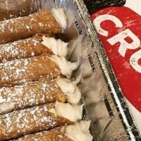 Cannoli · Crispy, golden cannoli shell filled with fresh made sweet ricotta filling.