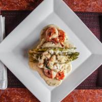 Chicken Fontina · With shrimp, crab, asparagus, fontina cheese, herb cream sauce over risotto.
