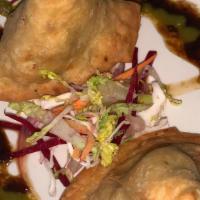Vegetable Samosa · Vegetarian. Two pieces of lightly spiced turnover stuffed with potatoes.