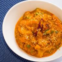 Coconut Veg Curry · Vegetarian. Mix vegetables cooked with coconut milk, onion and tomato sauce. Served with bas...