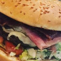 X-Tudo Burger · With ham, cheese, bacon, egg, corn, lettuce and tomato, and stick potato.