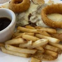 *French Dip Beef · With provolone cheese and onion rings and side of hot au jus gravy for dipping.