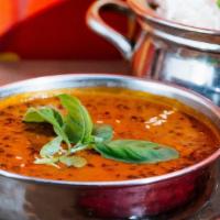 Dal Makhani. · Lentil Delicacy Flavored With Onions / Tomatoes / Ginger / Garlic / Cream