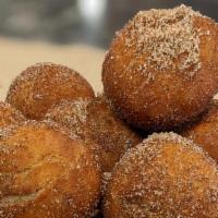Doughnut Holes · doughnut holes rolled in cinnamon & sugar, served with 
chocolate and caramel sauce