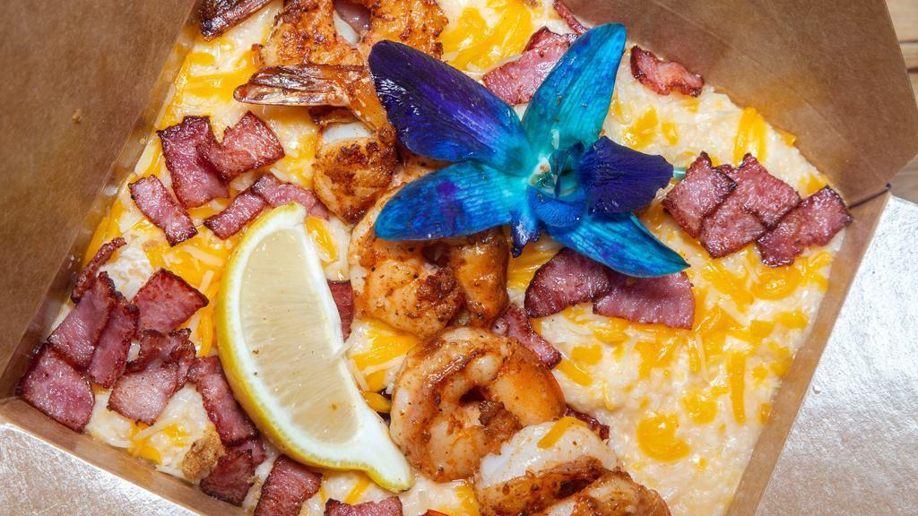 Shrimp & Grits · Our savory 3 cheese grits topped with grilled or fried shrimp.
