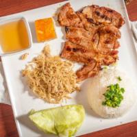 Com Tam Suon Bi Cha Platter · Broken rice with a grilled pork chop, shredded pork skin, and steam egg meatloaf.