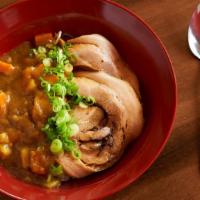 Chashu Curry Rice · Tender chashu pork over jasmine rice served with Japanese curry topped with diced carrots, d...
