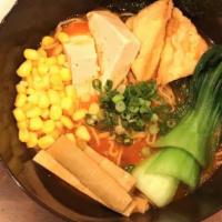 Spicy Tofu Ramen · Steamed and Fried Tofu served with Spicy Vegetable broth topped with Bok Choy, corn, scallio...