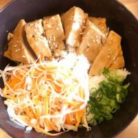 Tofu Teriyaki Rice · Vegetarian. Steamed and fried tofu over jasmine rice served with house teriyaki sauce topped...