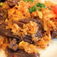 Kimchi Fried Rice · Fried rice with meat pan-fried with house sauce, Kimchi, egg, garlic, onion, carrot, peas an...