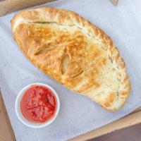 Calzone · Baked golden brown, with our fresh dough stuffed with grande mozzarella, provolone, and rico...