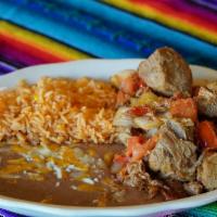 Pork Carnitas · Fried tender pork seasoned with onions and tomatoes. Served with rice, beans and three our t...