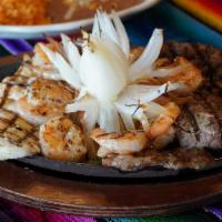 El Norteno · Full rib-eye steak and grilled chicken breast with grilled shrimp, bell peppers, garnished w...