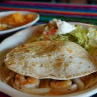 Camarones Quesadilla · Flour tortilla grilled and stuffed with shrimp, cheese, bell peppers and onions served with ...