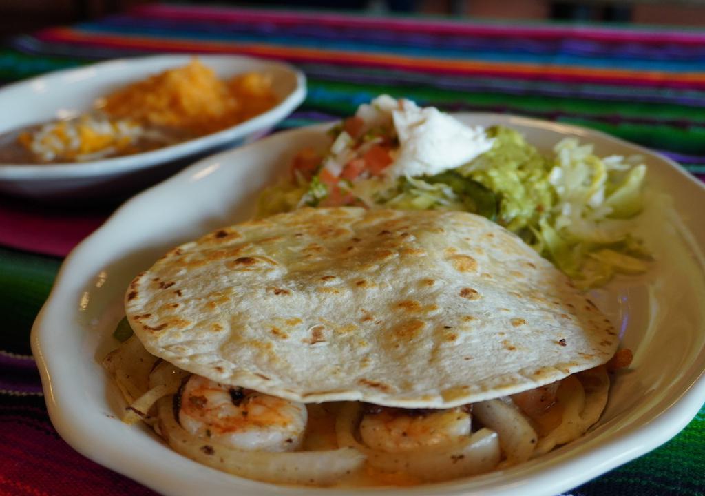 Camarones Quesadilla · Flour tortilla grilled and stuffed with shrimp, cheese, bell peppers and onions served with rice, beans and guacamole salad.